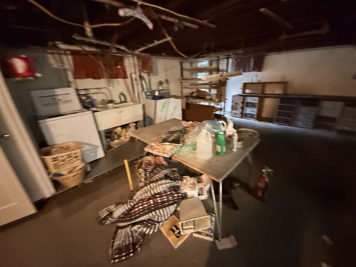 Full basement cleanout — before Apex Junk Removal completed the work