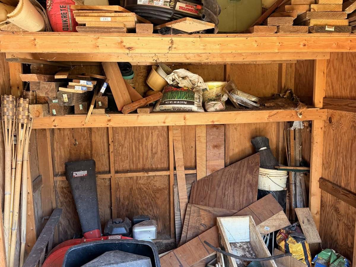 Backyard shed cleanout — before Apex Junk Removal completed the work